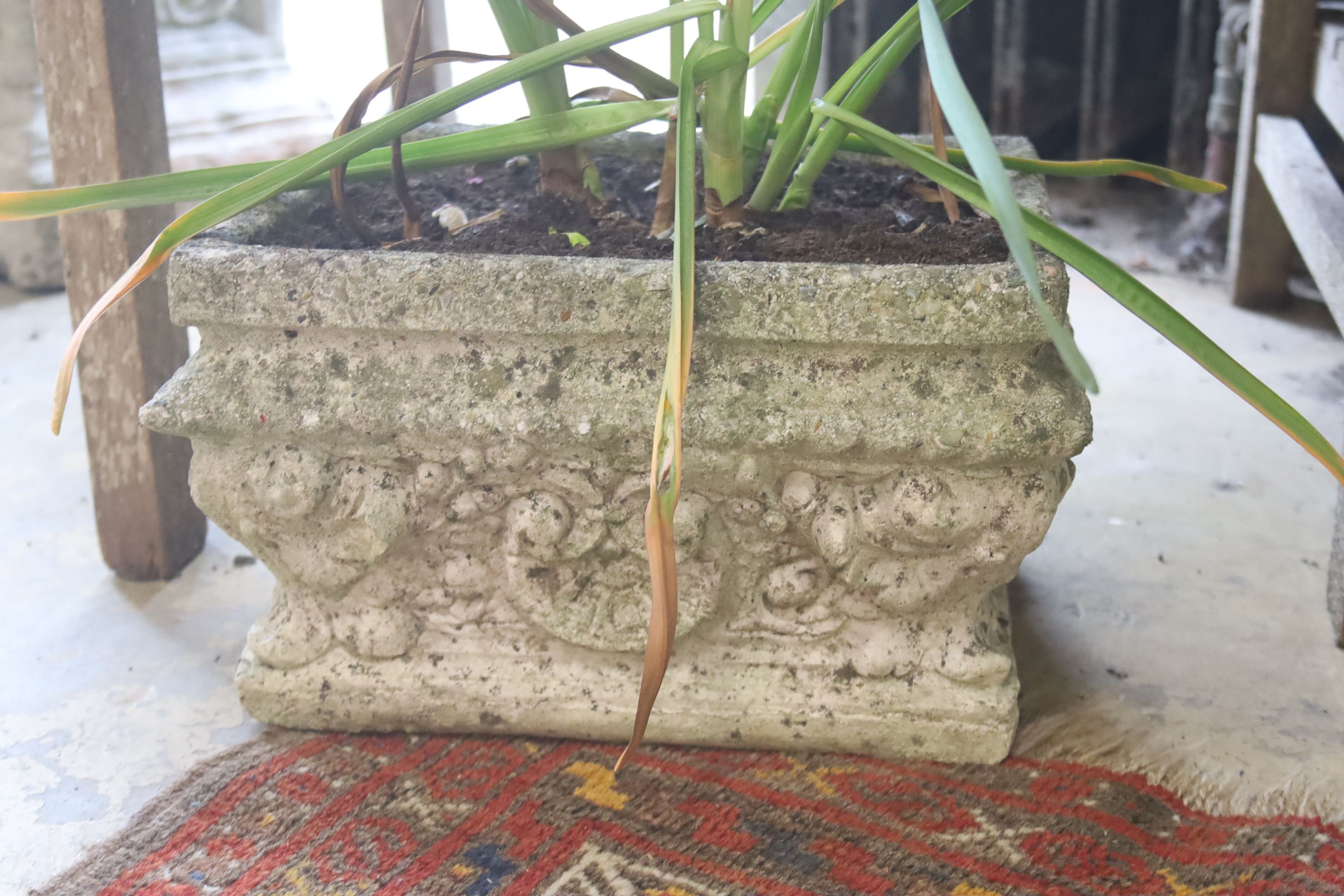 A pair of rectangular reconstituted stone garden planters, width 33cm, depth 27cm, height 20cm